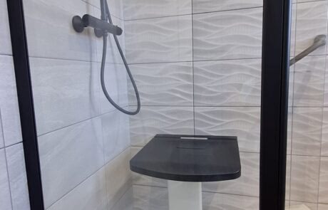 new bathroom with shower seat 1